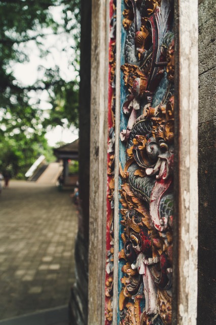 A photo of a carved, wooden door that is open. 
